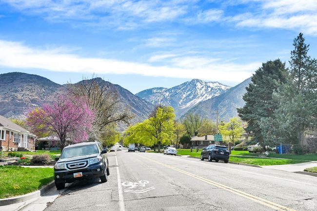 View of road featuring curbs, sidewalks, and a mountain view | Image 29