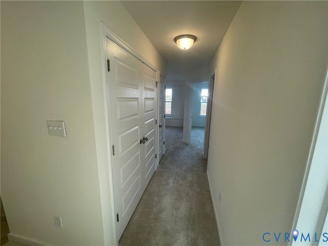 Hall with carpet and baseboards | Image 13