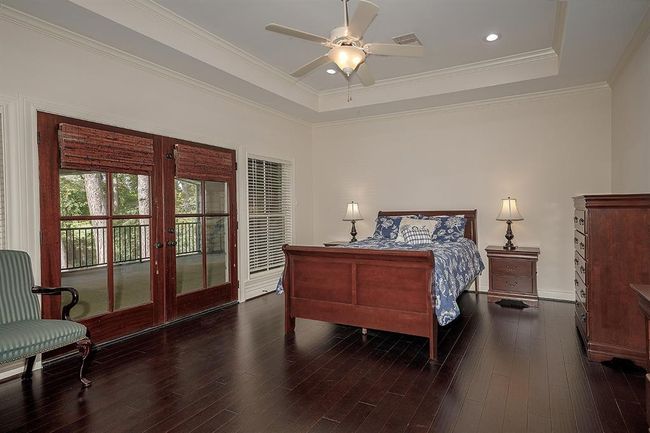 One of the 2nd floor bedrooms with an en-suite bath, walk-in closet and balcony | Image 29