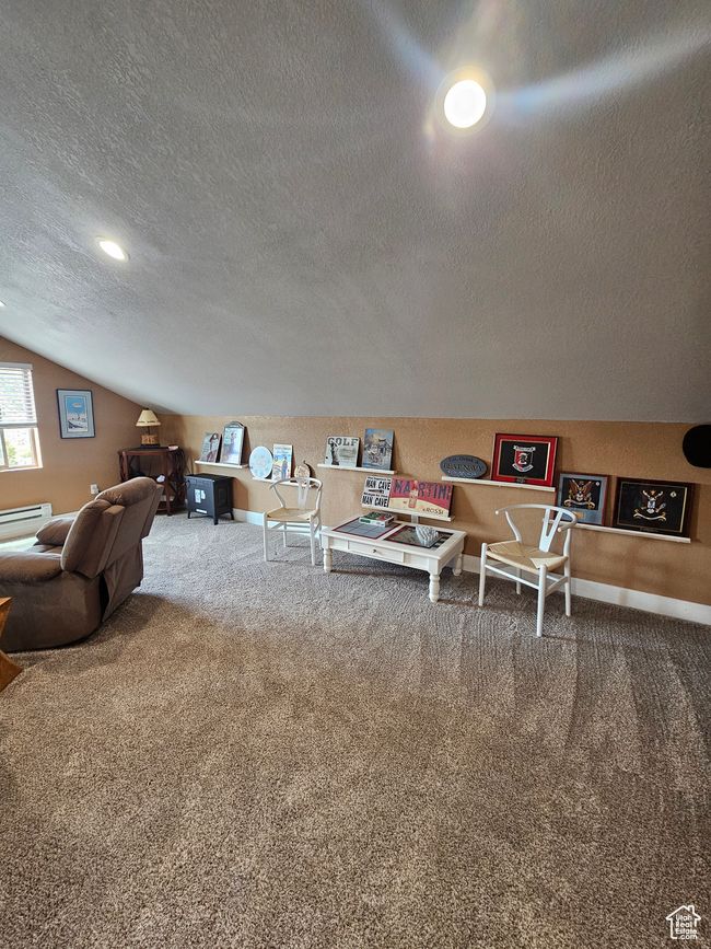 Upstairs living room featuring a healthy amount of sunlight and lofted ceiling | Image 49