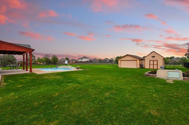 1+ acre lot; note two storage buildings AND in-ground storm shelter. | Image 38