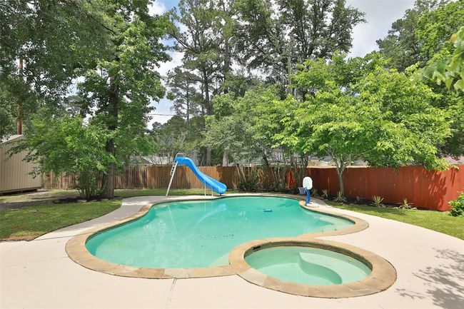 Heated spa and pool with slide. | Image 36