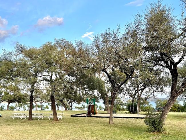View of property's community with a lawn | Image 4