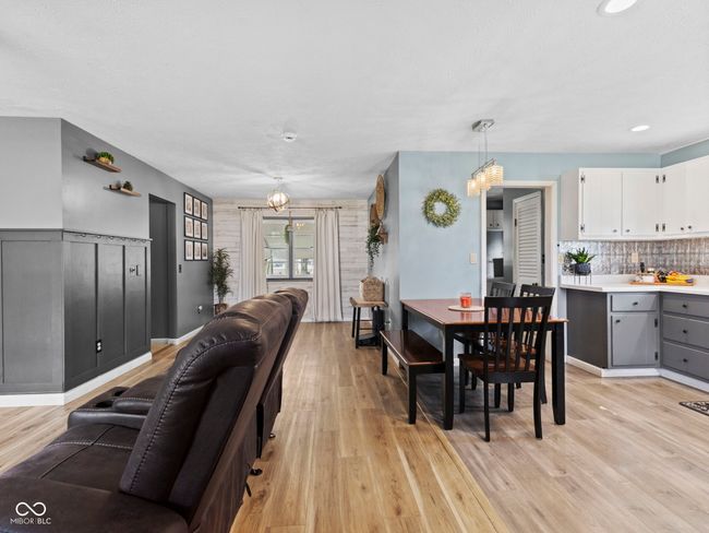 dining room featuring light wood-style flooring | Image 5