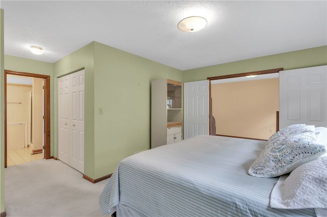 Bedroom #2 with Double Door Entry Offers a Double Closet/Dressing Area and en Suite Bath. | Image 27