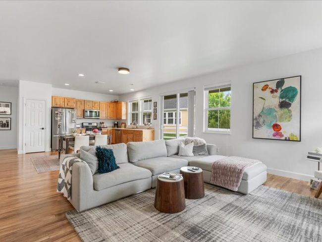 Living area featuring light wood-style flooring and recessed lighting | Image 12