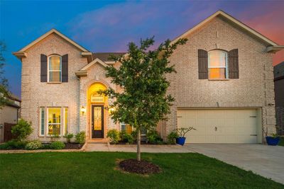 French country style house featuring a yard and a garage | Image 3