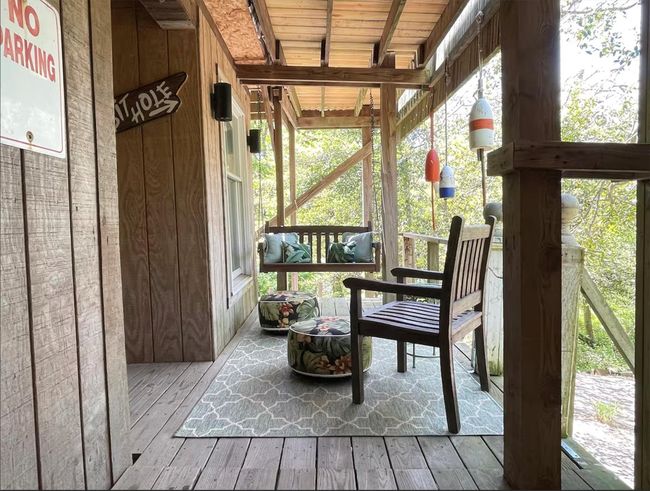 Sunroom featuring beamed ceiling | Image 15