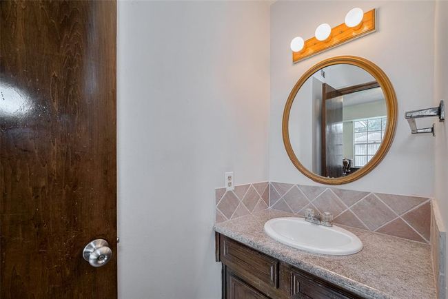 Cozy first-floor half bath for added convenience. | Image 30