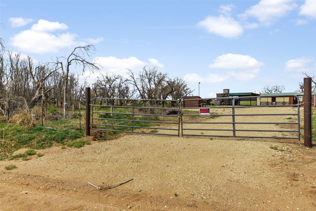 View of gate featuring fence | Image 29