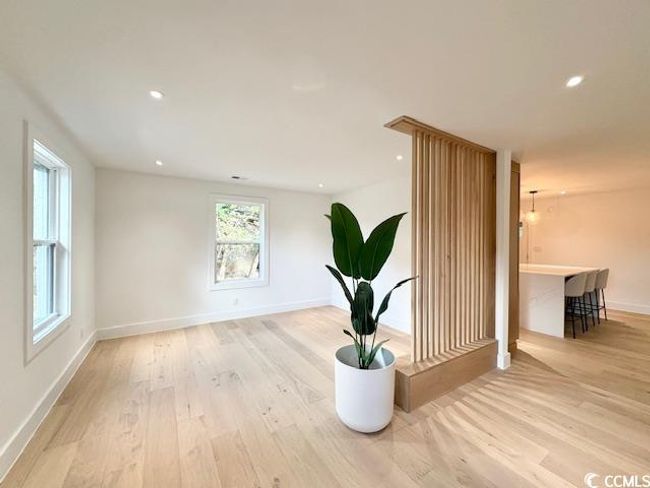 Unfurnished room with light wood finished floors and recessed lighting | Image 8