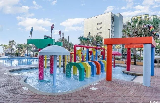 Community jungle gym featuring a water play area and a community pool | Image 19