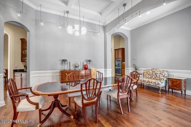 Dining room with butler's pantry to the left and entrance to kitchen on the right | Image 10