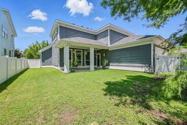 Rear view of property featuring a shingled roof | Image 39