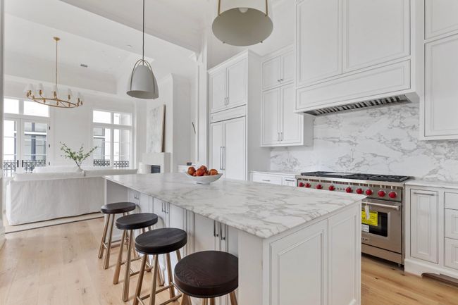 The gorgeous kitchen area features custom built cabinets with inset soft close doors and Emtek hardware. | Image 17