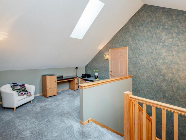 Upper level loft area with skylight. | Image 18