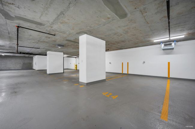 Parking deck featuring baseboards and a heating unit | Image 24