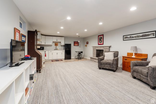 Living room featuring recessed lighting, a fireplace, and baseboards | Image 21