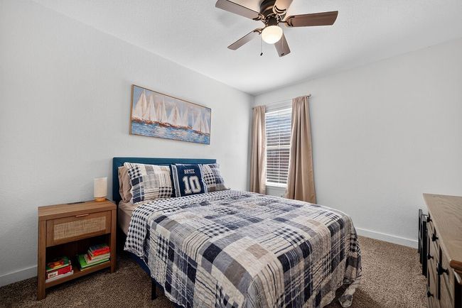 Carpeted bedroom with baseboards and a ceiling fan | Image 15