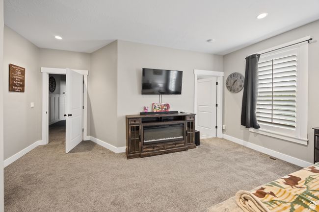Carpeted living area featuring baseboards and recessed lighting | Image 37