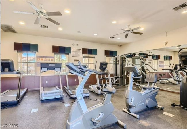 Exercise room featuring recessed lighting, ceiling fan, and visible vents | Image 21