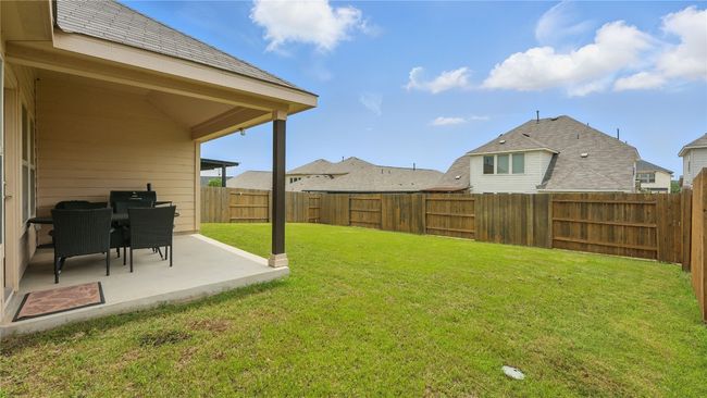 Fenced backyard featuring a patio area | Image 34
