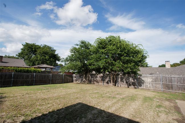 View of fenced backyard | Image 30