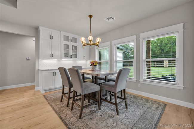 Dining overlooking backyard | Image 11