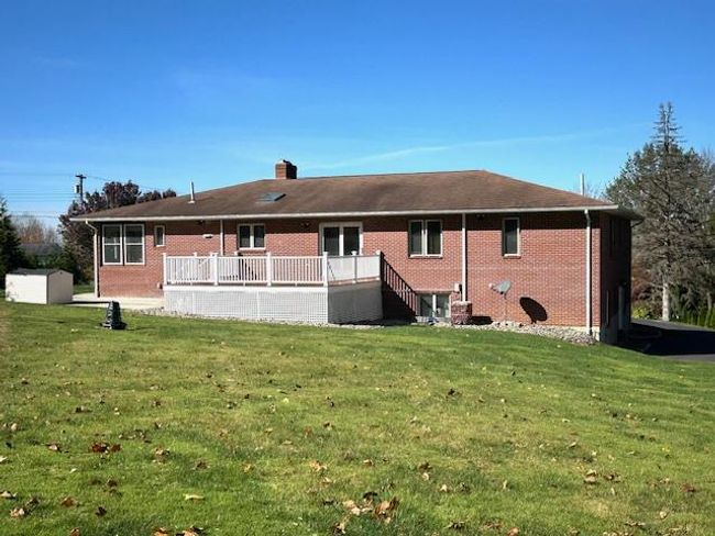 Back of property featuring a wooden deck and a lawn | Image 29