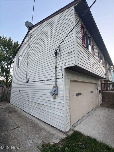 View of side of property featuring a garage | Image 3