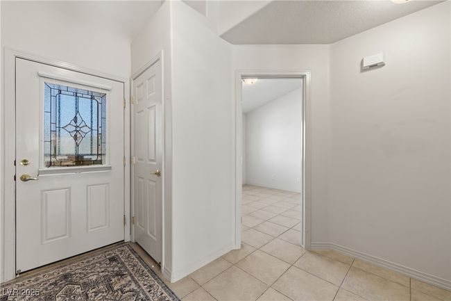 Foyer featuring light tile patterned flooring and baseboards | Image 9