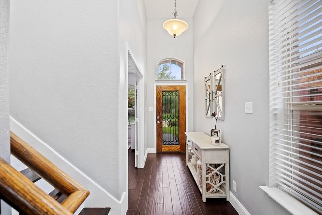 Entrance foyer featuring dark wood-type flooring and a high ceiling | Image 20