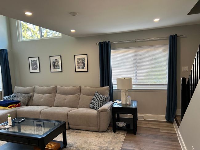 Living area featuring wood finished floors, recessed lighting, baseboards, and stairway | Image 19