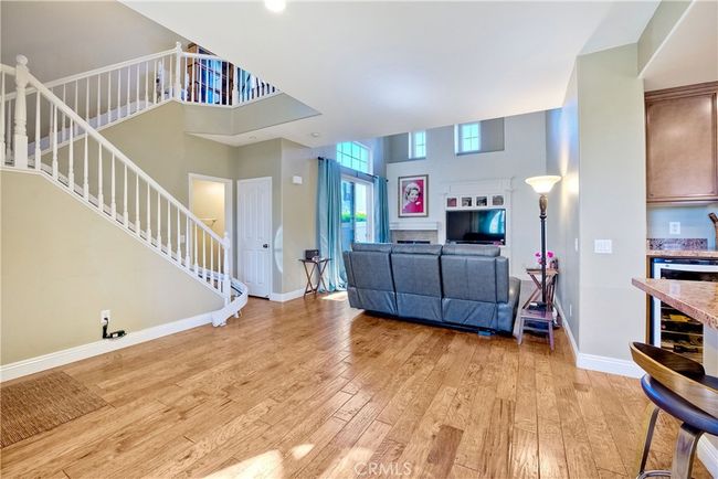 Photo looking toward living room from dining area, note the gleaming wood plank style flooring | Image 15