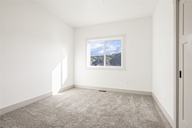Unfurnished room featuring carpet flooring and baseboards | Image 25