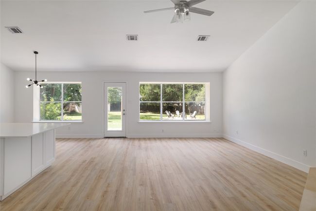 Large living room with clear views into the backyard. | Image 8