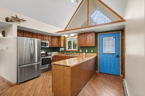 833 Newman St, East Tawas, MI, 48730-9747 | Card Image