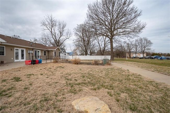 View of yard with french doors, a patio area, and fence | Image 39