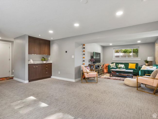 Living room featuring light colored carpet and recessed lighting | Image 30