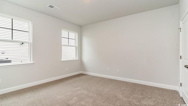 View of carpeted spare room | Image 7