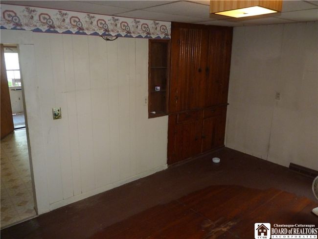Dining area with wood floors | Image 11