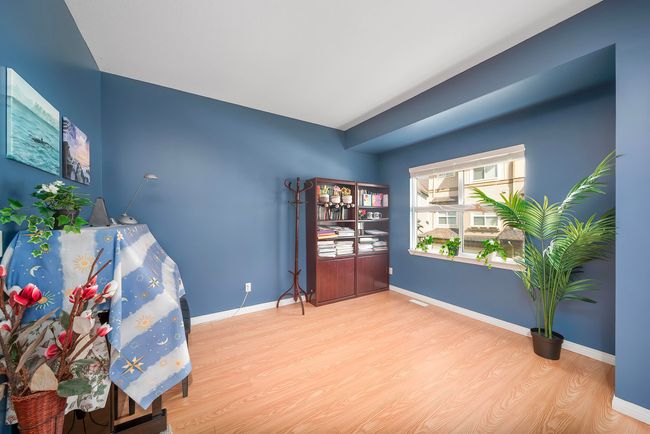 Living area with visible vents, baseboards, and wood finished floors | Image 22