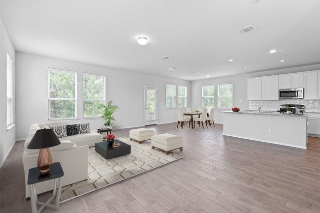 Living room with light wood-type flooring and recessed lighting | Image 4