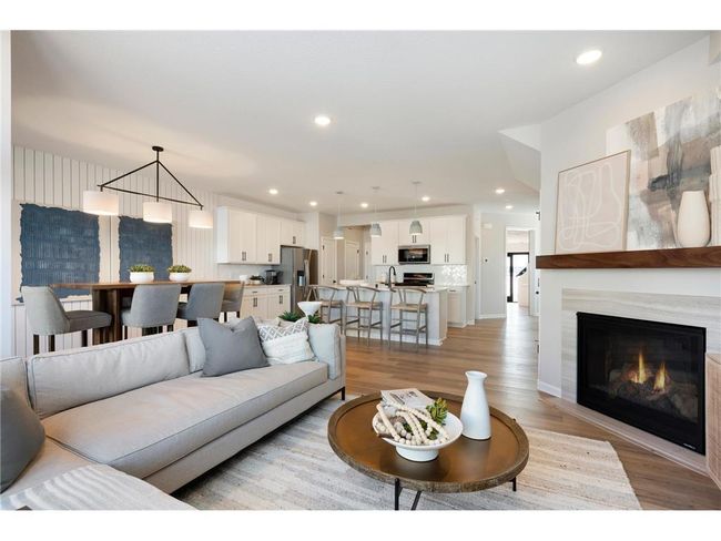Come over to the living room perfect for any occasion! Both spacious and luxurious, this living room is perfect for any occasion! Photo of model home. | Image 27