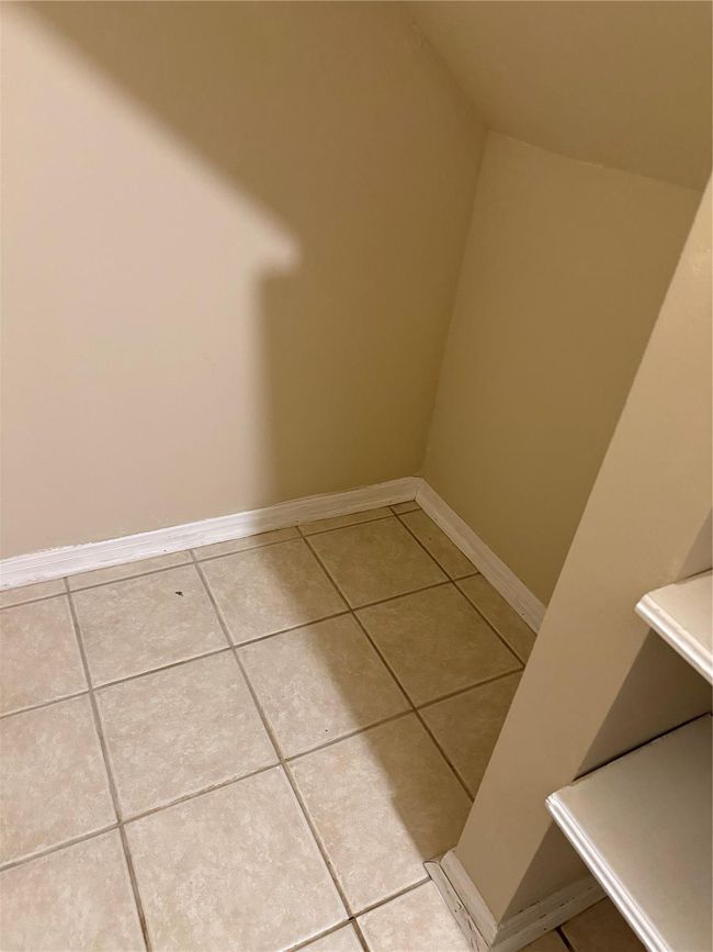 Extra storage area in the pantry, under the stairs. | Image 18