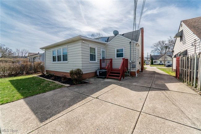 Back of house featuring fence, central AC, and a yard | Image 36