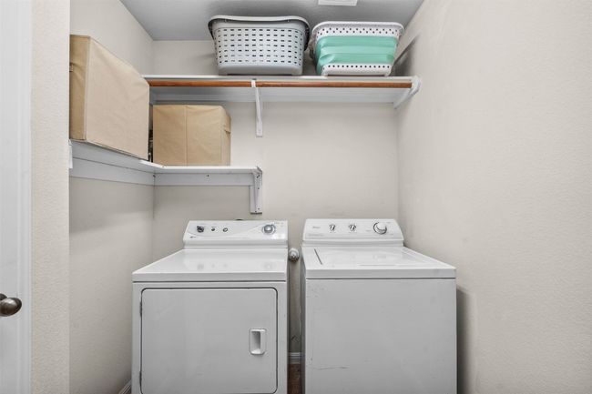 Clothes washing area with washer and clothes dryer and laundry area | Image 25