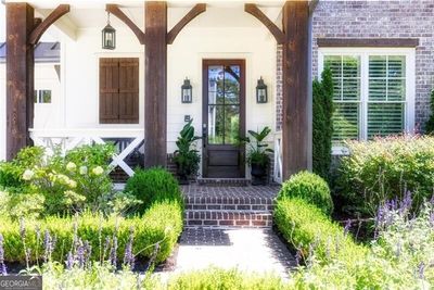 Gorgeous landscaping and pretty details inside and out! | Image 3