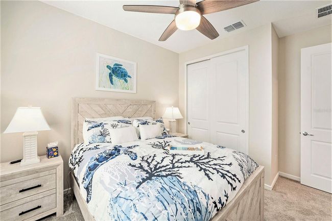 Bedroom #2 and large built in closet. Privately located in the front of the home. Plantation Shutters too! | Image 16