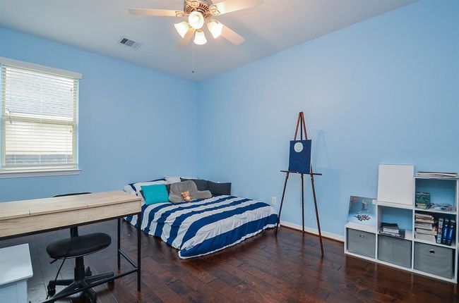 Secondary bedroom upstairs with access to a shared bathroom. | Image 25